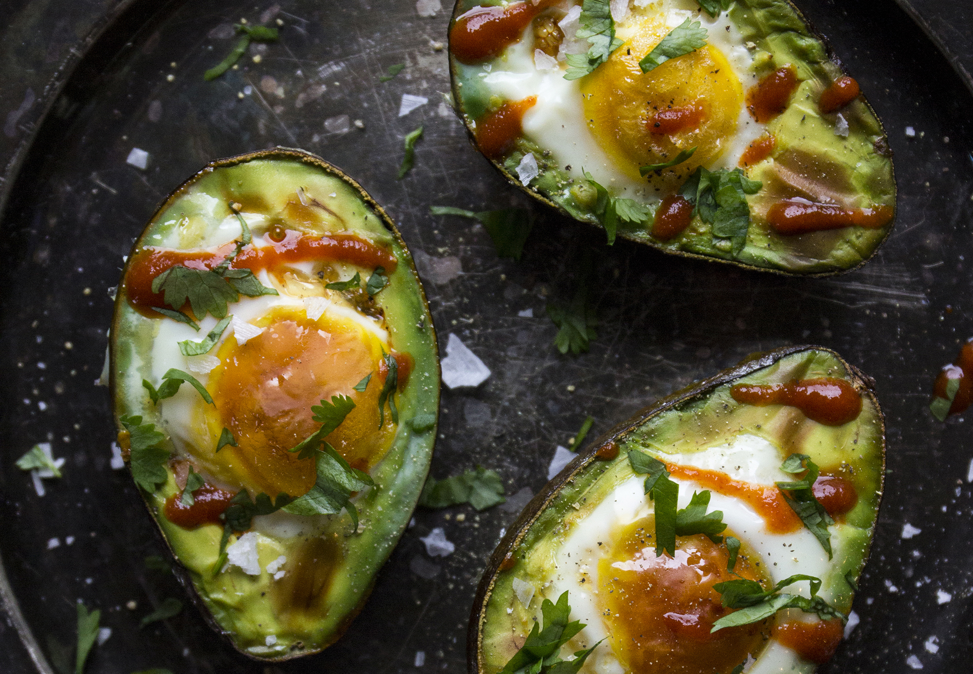 Spicy Avocado Baked Eggs    Shake up your breakfast routine with these spicy avocado baked eggs!